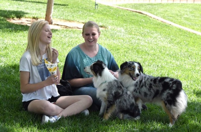Hilary and friend with two dogs